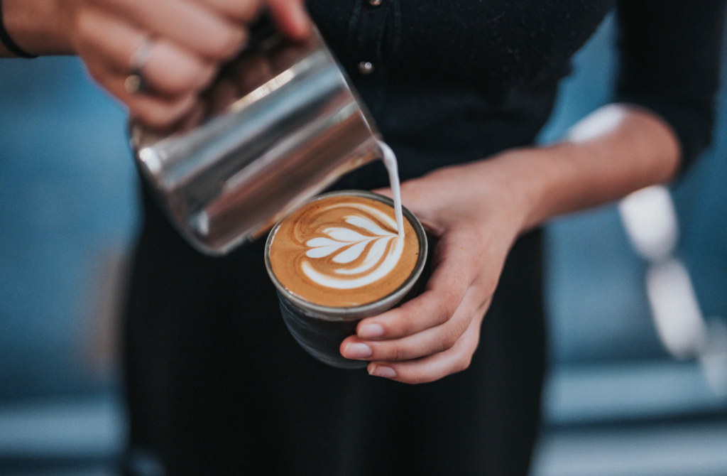 barista pouring latte, part-time job