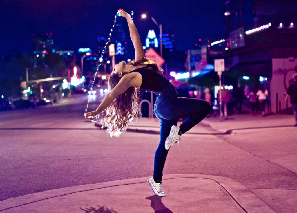 woman dancing on street, reading week