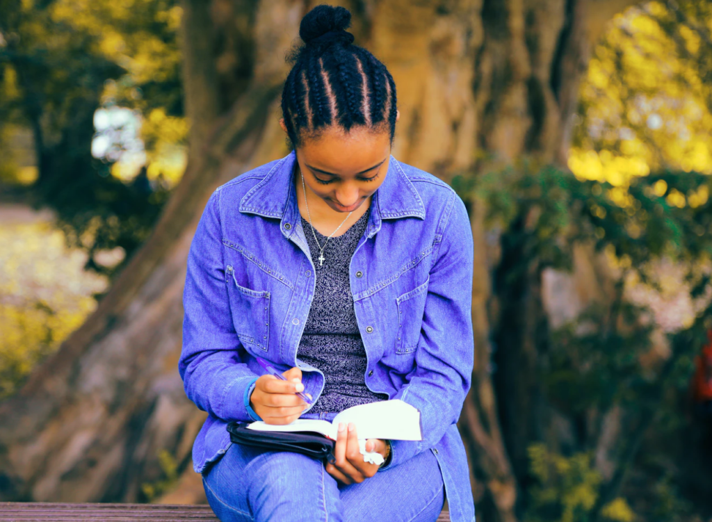 online learning at york, student sitting with book