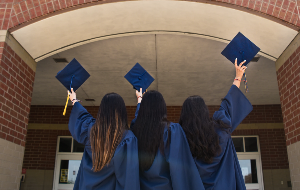 toronto grads three graduates holding caps