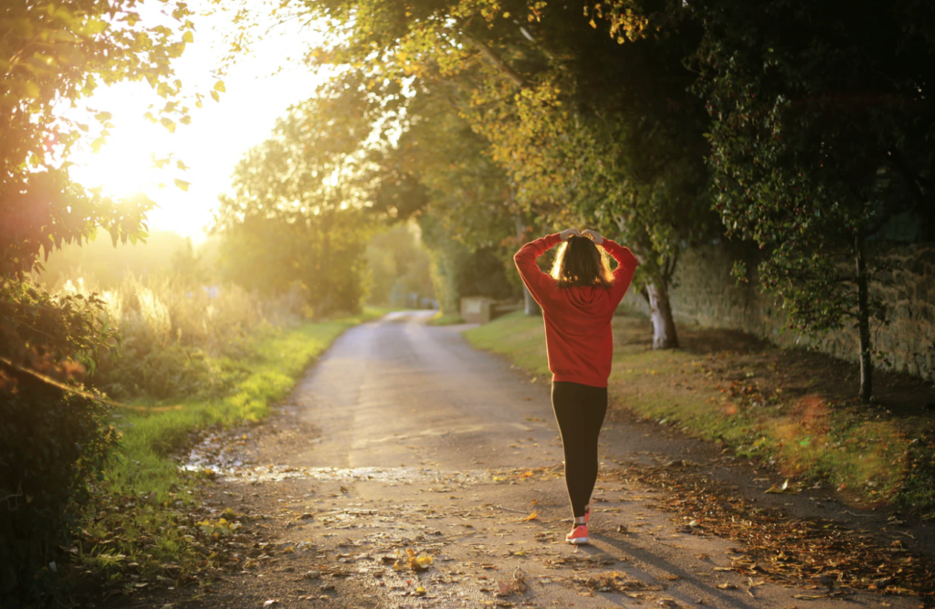 mental health resources girl walking on dirt road during sunset