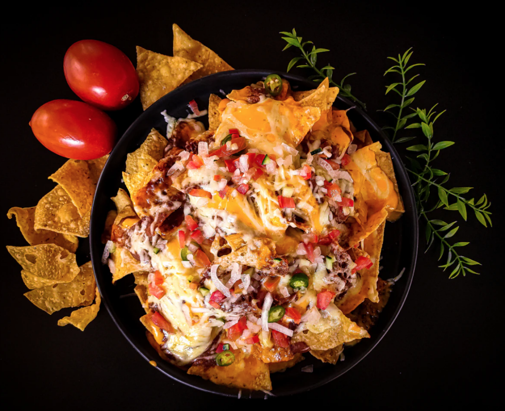 nacho platter on dark table university of manitoba