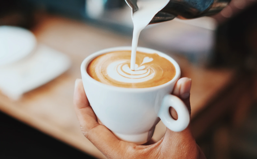 north atlantic coffee spots , barista pouring latte with heart