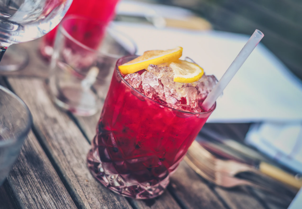 pink cocktail drink with ice and lemon , drink around brock university