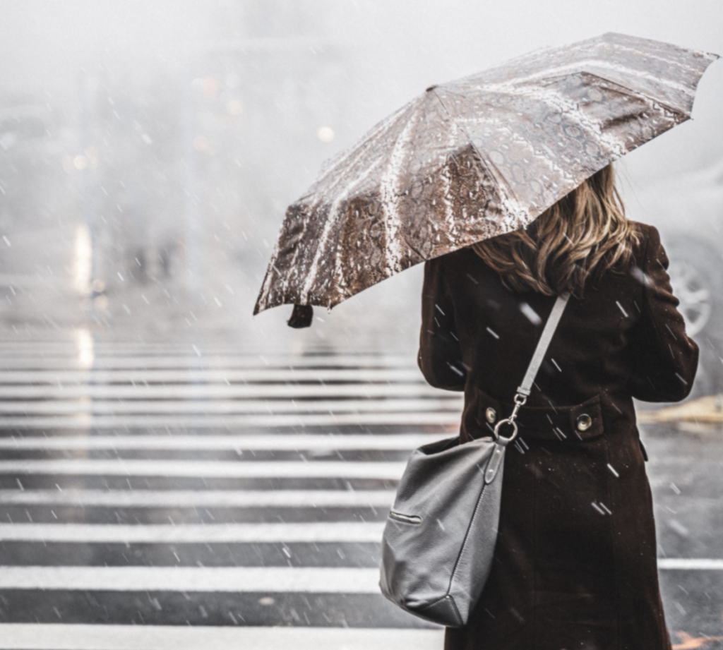 standing on a foggy street facing away from the camera with an umbrella, university of waterloo